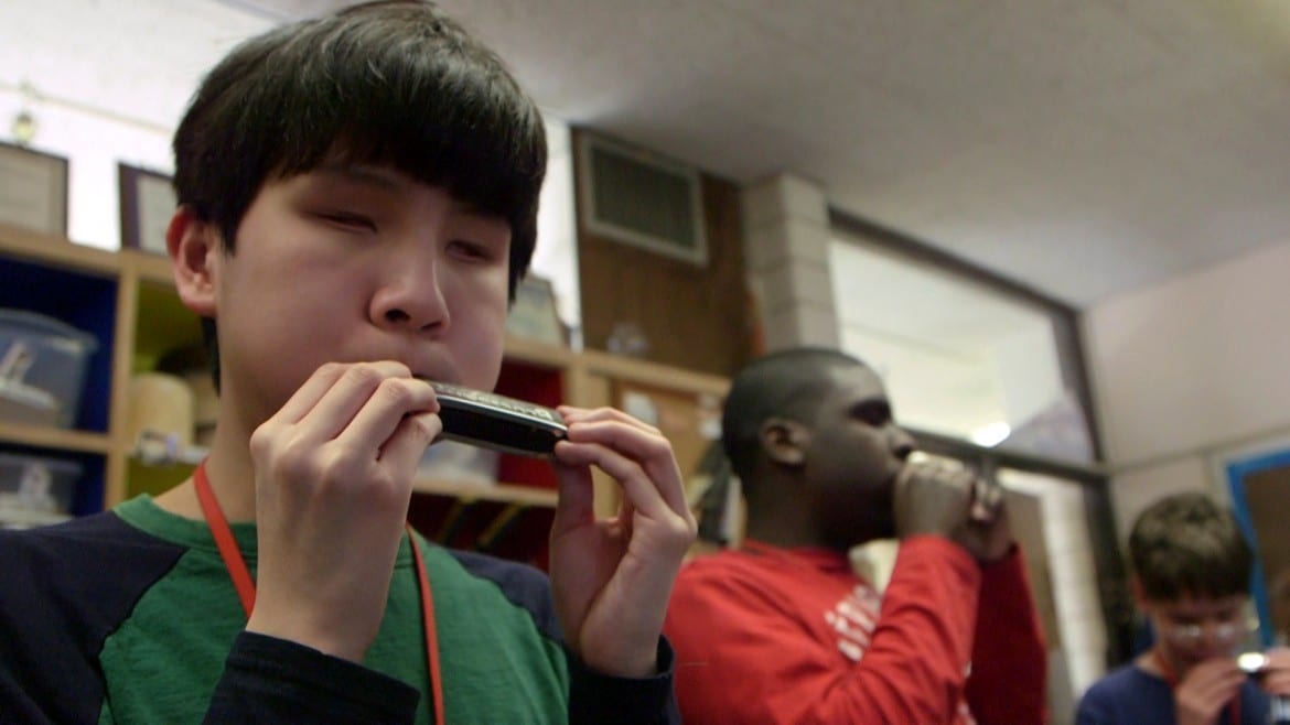 KSSB Student Gabriel Lewis plays his first notes on his brand new harmonica.