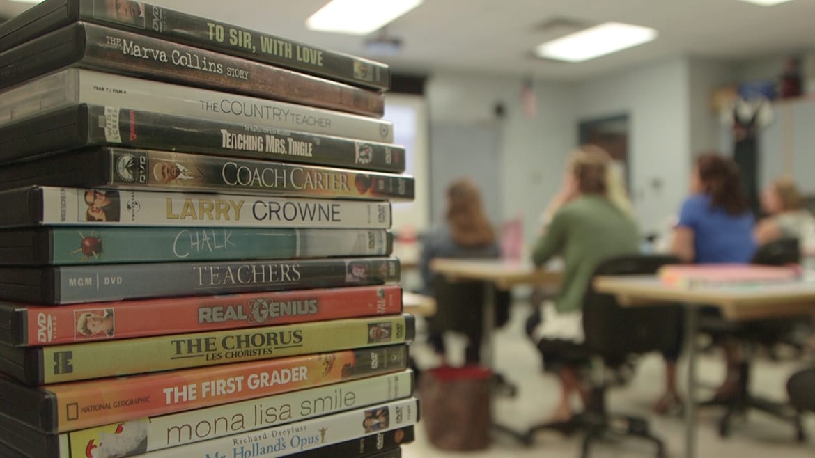 Photo of stack of DVDs in a classroom.