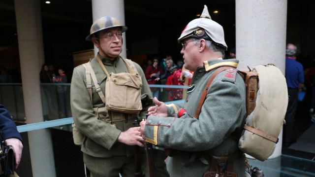 Living history interpreters Charles Pautler (left) and Bruce Enlow are dressed as an American soldier and an early-war German soldier. Russian, British and French soldiers were also represented this morning at the WWI museum. (photo by Caitlin Cress/Hale Center for Journalism)