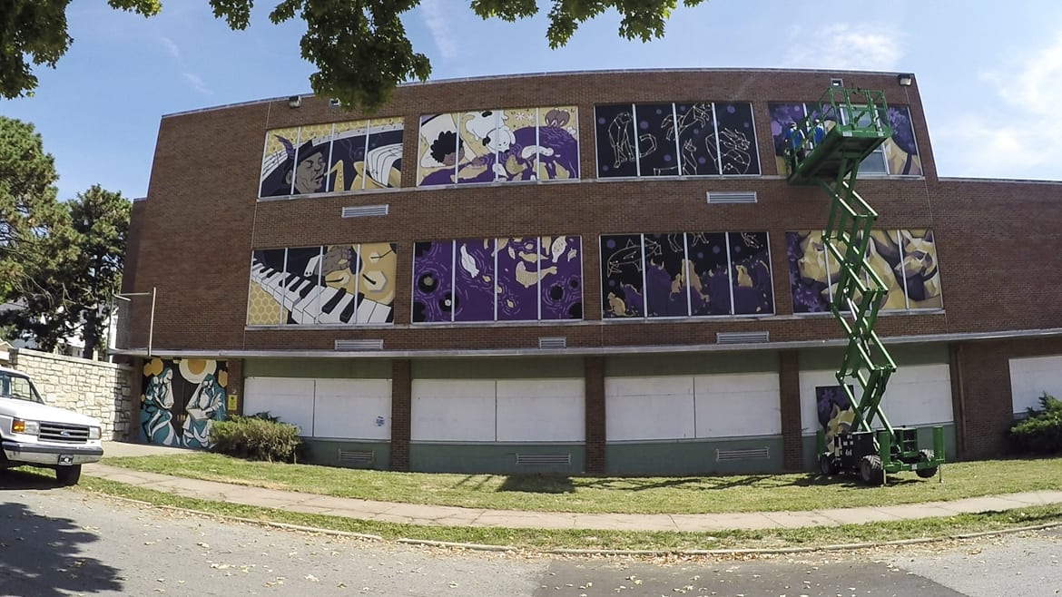 Art panels are installed on the abandoned building that housed Scarritt Elementary as part of a beautification project with the Kansas City Art Institute.
