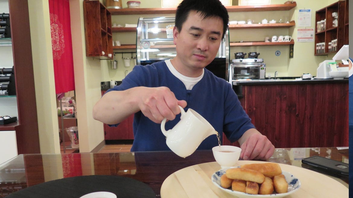 Pouring tea with sweet bread.