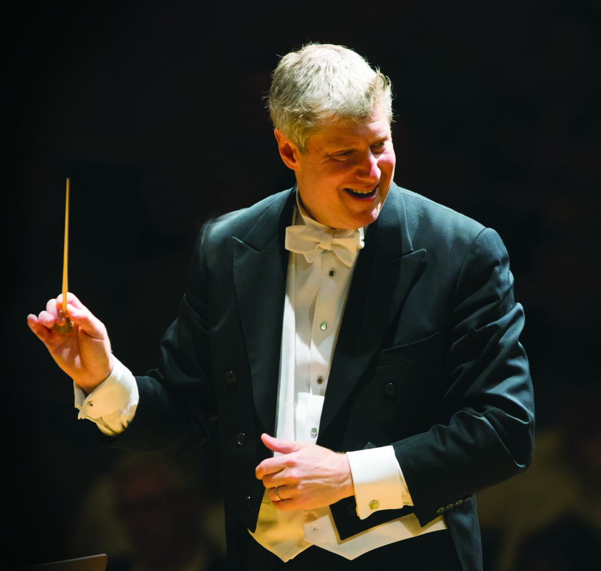 a man conducting an orchestra.