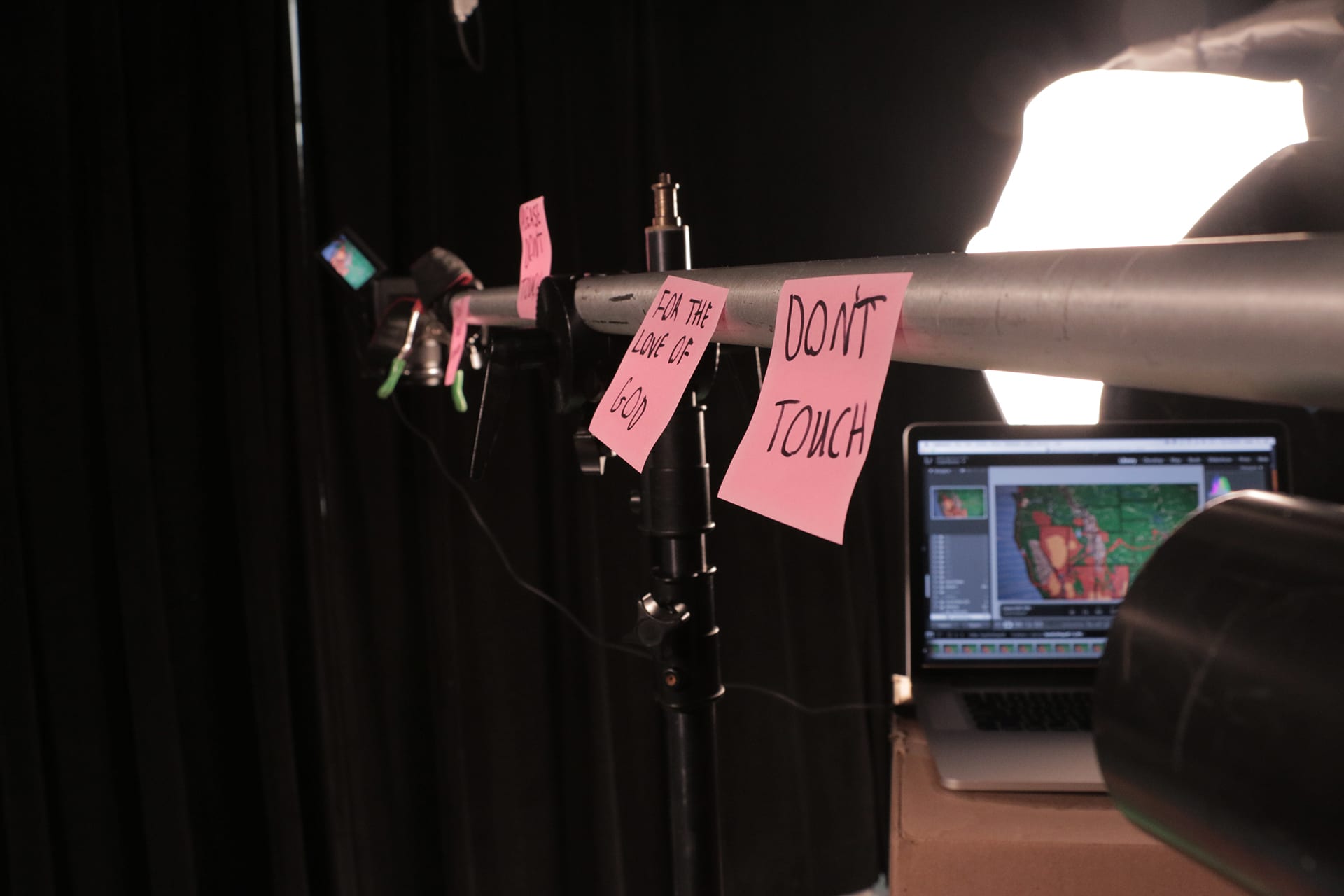 Sticky-notes on the camera arm pleading to not be touched.