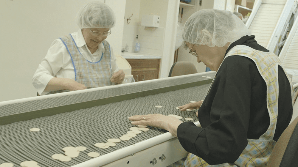 sisters perform quality control on the altar bread