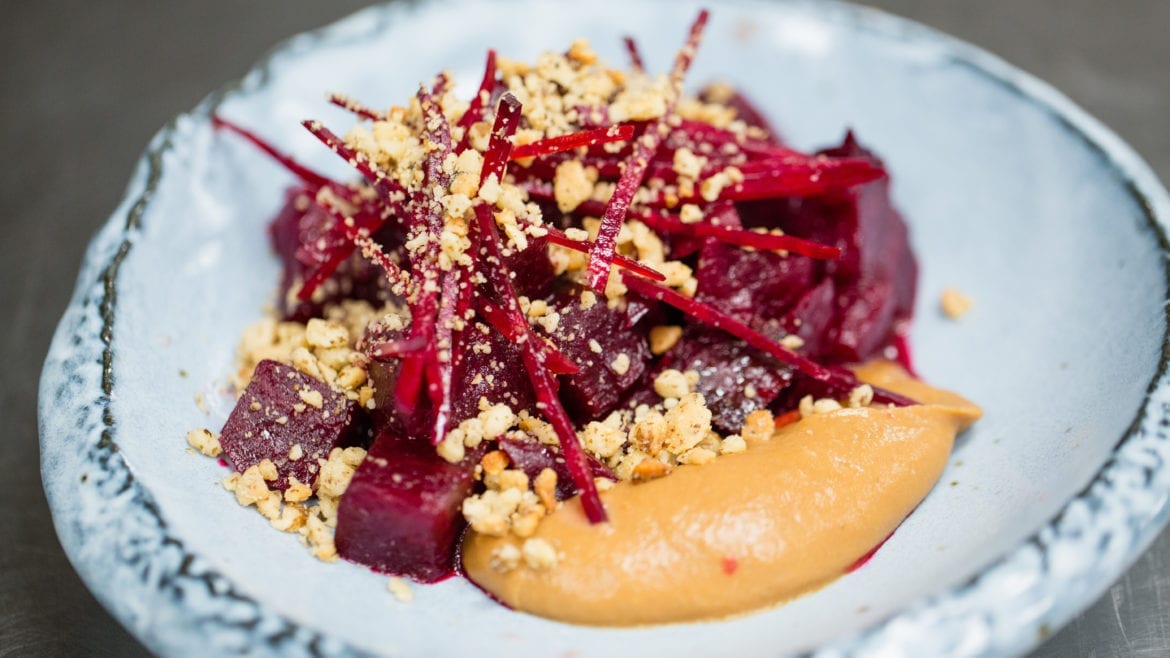The roasted beets are served with pear butter and black walnuts at Corvino