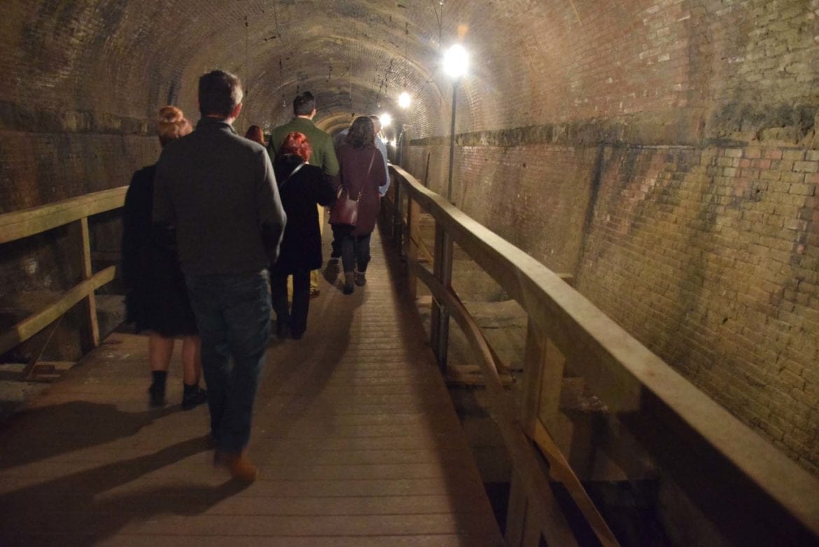 a tour group in the eighth street tunnel
