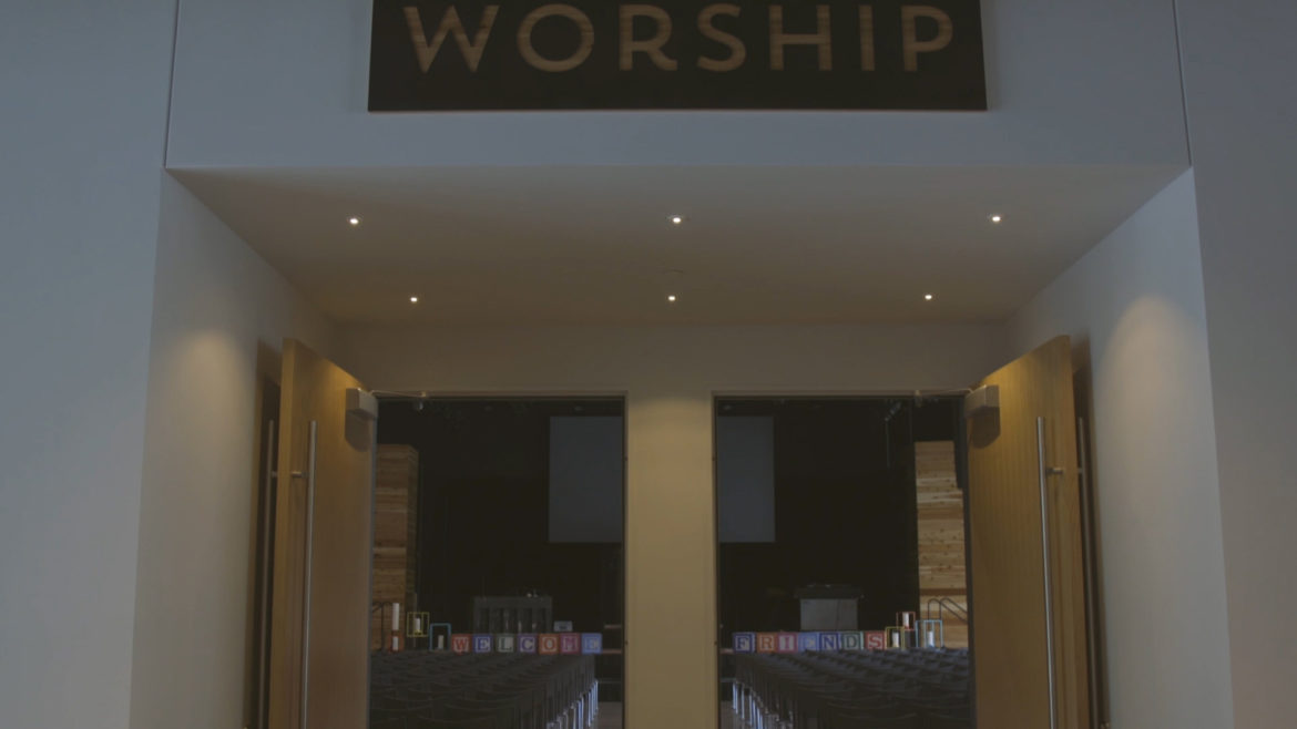 worship sign above sanctuary door