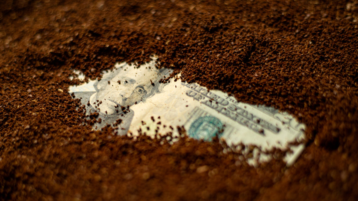 Money buried beneath coffee grounds