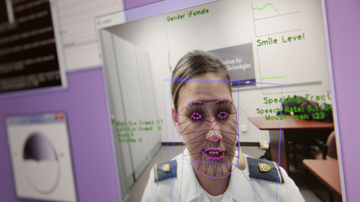 A computer monitors some of Cadet Cheyenne Quilter's reactions as she works with a virtual reality character named 