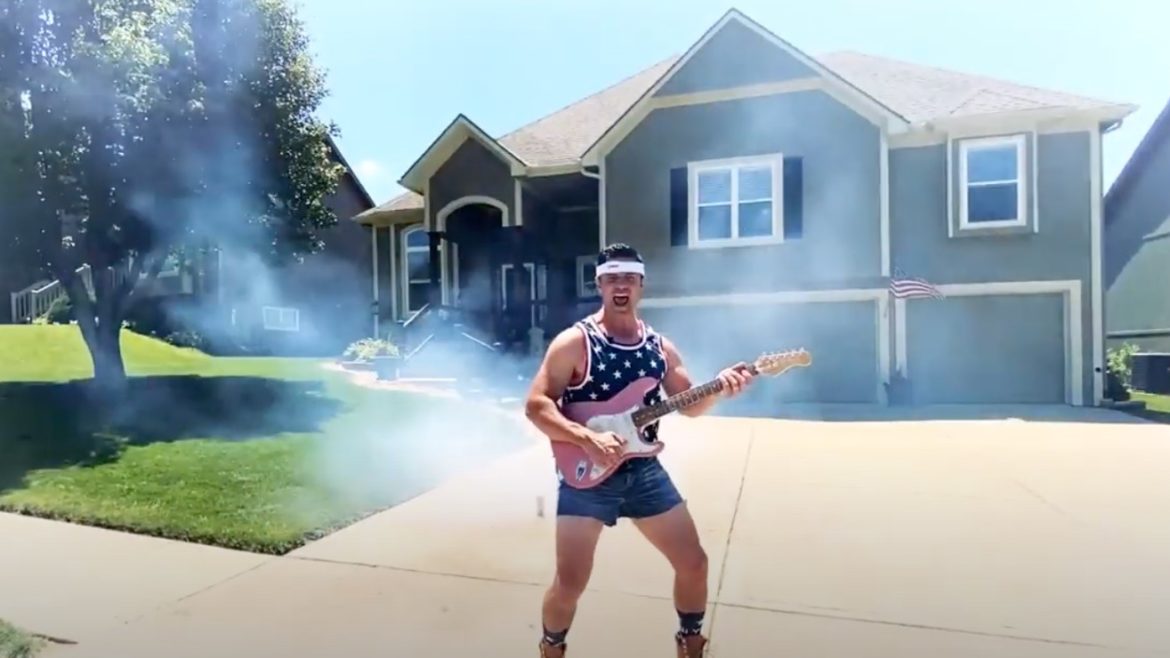 Realtor Jason Rains jams out in front of a home for a patriotic July 4th video.