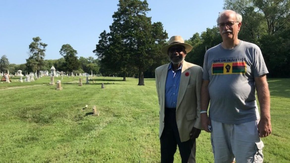 Shelton Ponder (left) and Harold Phillips, co-chairs of the Liberty African American Legacy Memorial project, stand in a formerly segregated portion of Fairview and New Hope Cemetery, where ground will be broken for the memorial on Saturday.