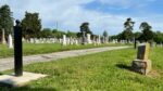 A series of posts, or bollards, marks the formerly segregated section of Fairview Cemetery in Liberty, where more than 750 individuals are believed to be buried, many of them in unmarked graves.