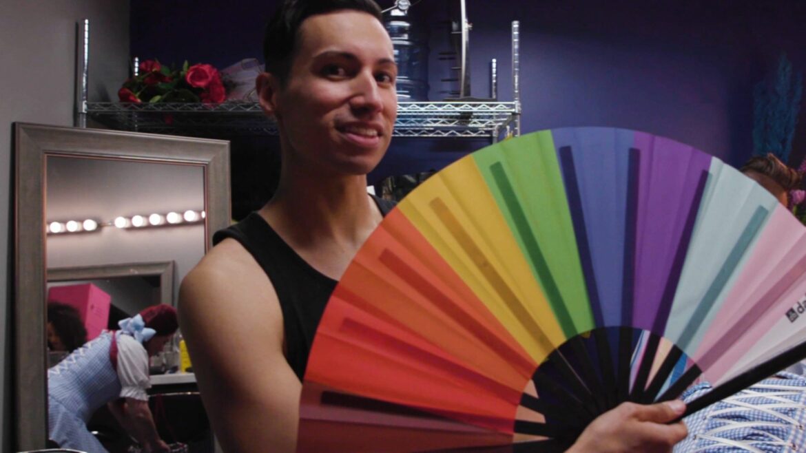 Person with rainbow fan