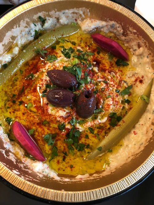 The hummus from Baba’s pantry is made from scratch and is garnished with olives and Chef Kamal’s pickled vegetables.