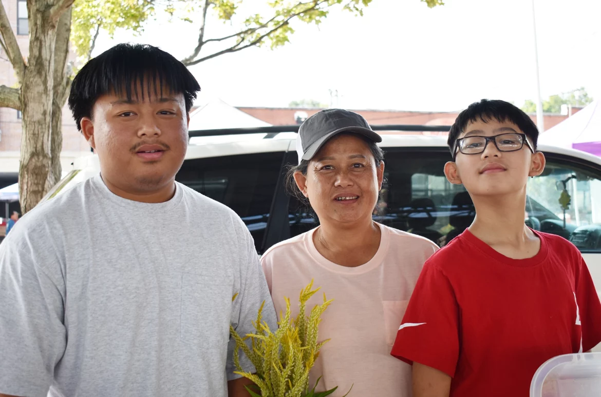 Sur Mu Na, center, and her sons, Pasaw, and Riley na phy, Mo Mo Ru Tha Farm, at the Overland Park Farmers Market.