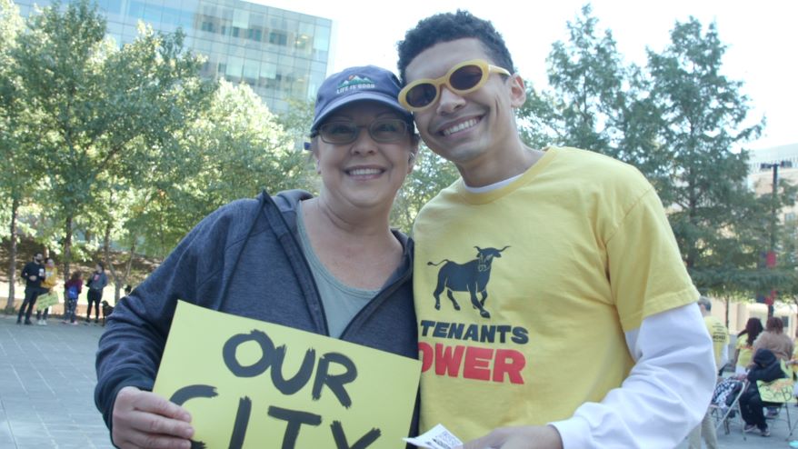 Brandon Henderson and his mother at a KC Tenants Power rally.