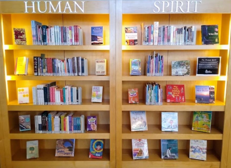 This double display case at the Kansas City Public Library's Country Club Plaza branch contains books donated to the library by an interfaith group called Cultural Crossroads.