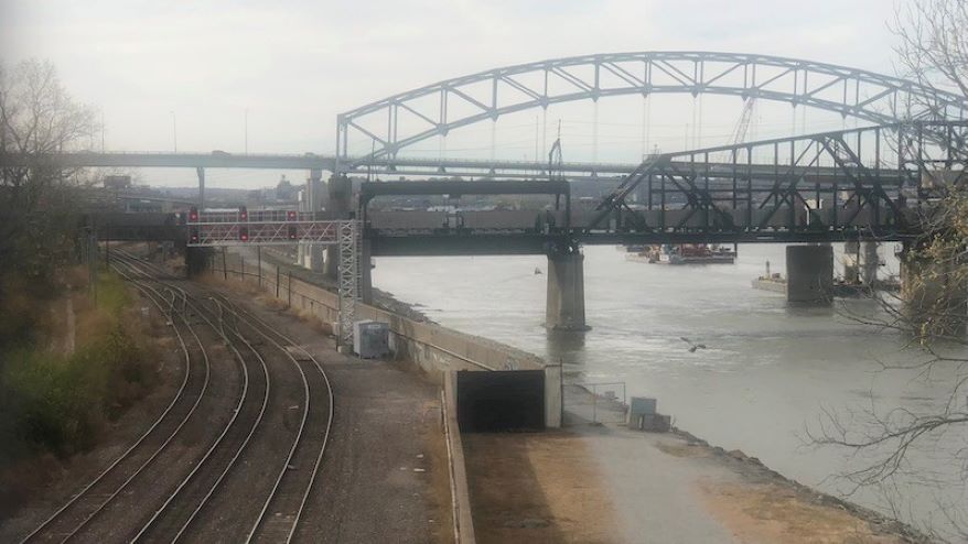 Among the challenges to reusing the old Buck O’Neil Bridge (background) as a linear park is a previously unknown MoDOT agreement with the railroads to remove its approach piers.