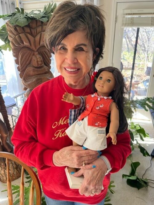 Dorinda Makanaonalani Nicholson with Nanea, an American Girl doll inspired by Nicholson’s Pearl Harbor story.