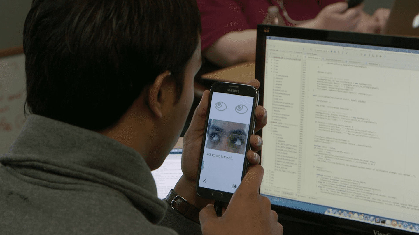 EyeVerify employee testing the app