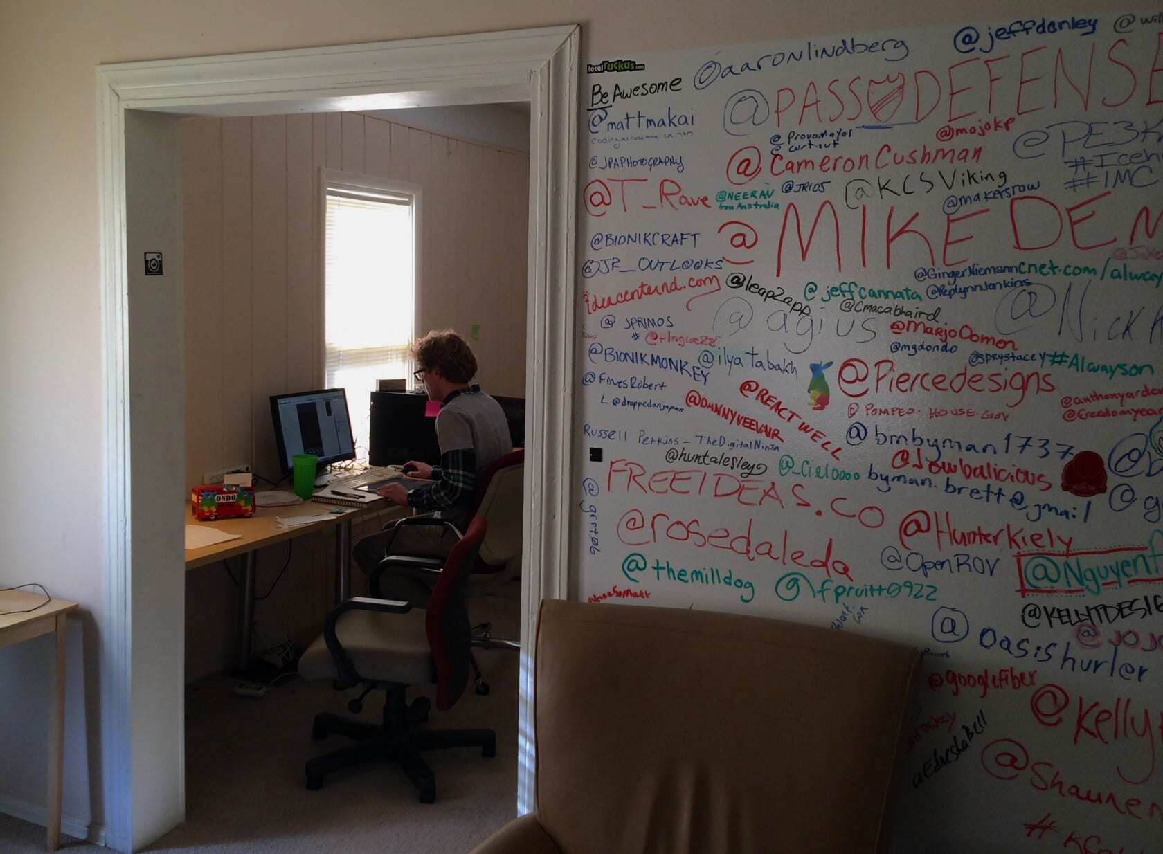 Kinsman working on his app design at the Homes for Hackers