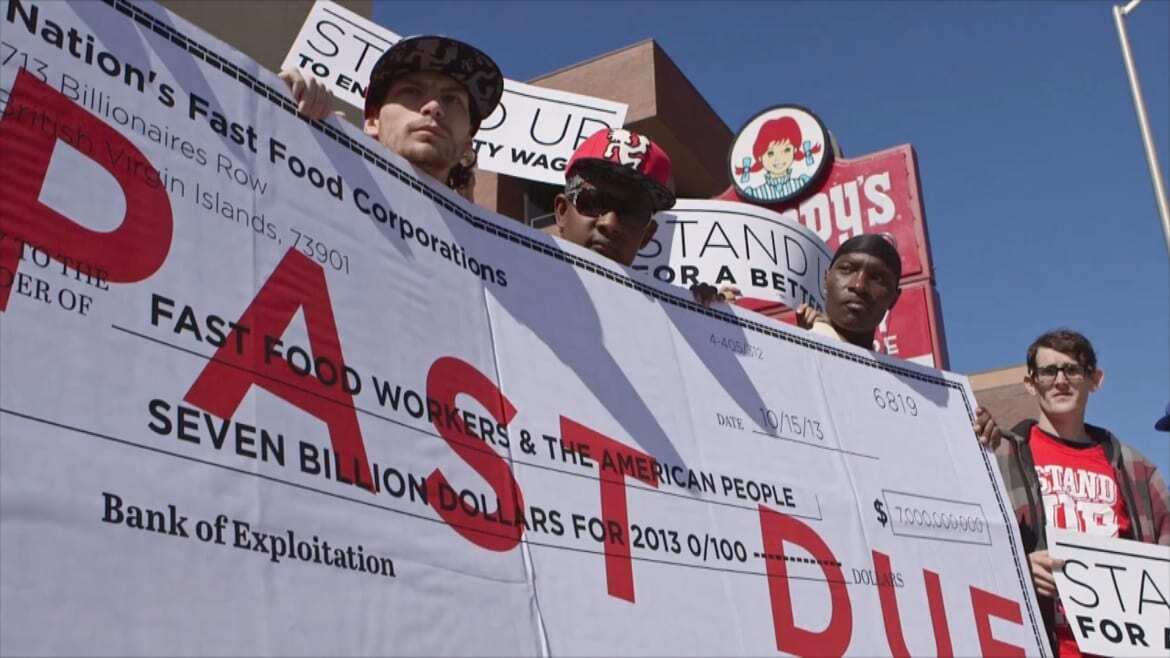 Fast food workers strike in effort to eliminate "poverty wage"