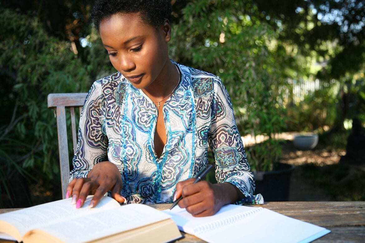 Woman working on papers at table