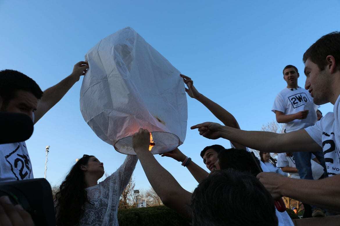Teens try to launch a lantern