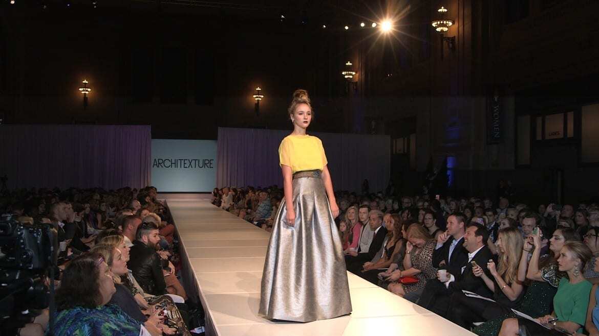 A runway model walks at KC Fashion Week.