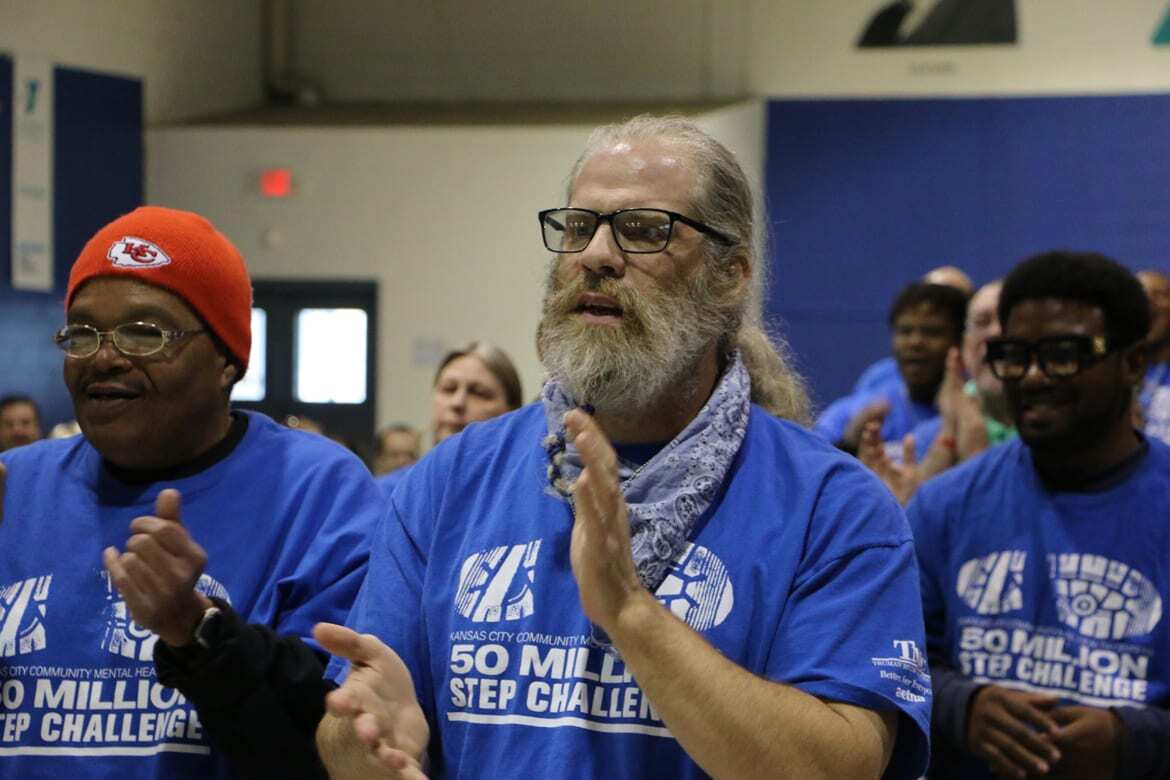 man cheers with team