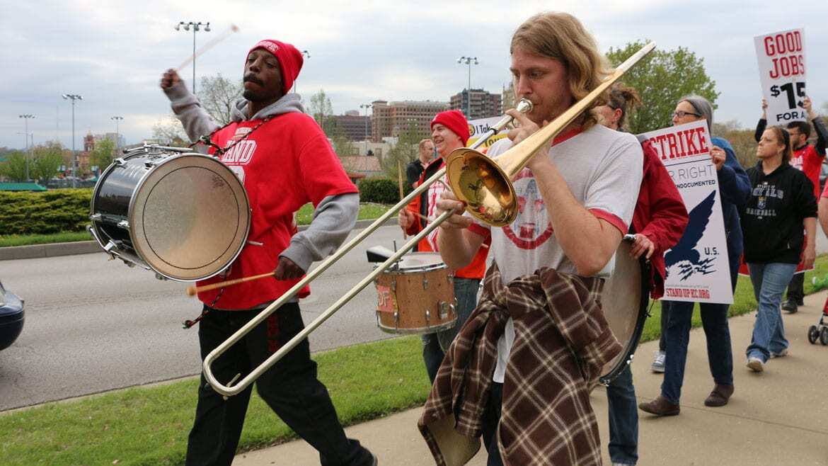 protesters marching with instruments