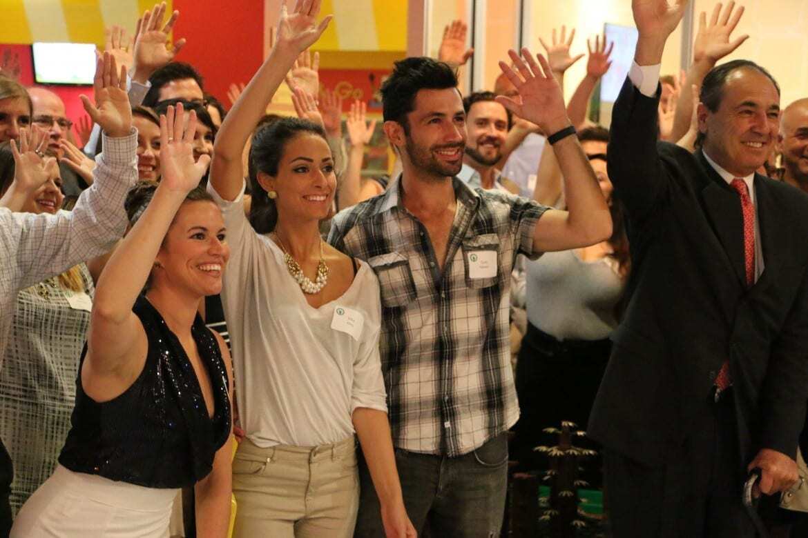 crowd raised their hands for kids at event