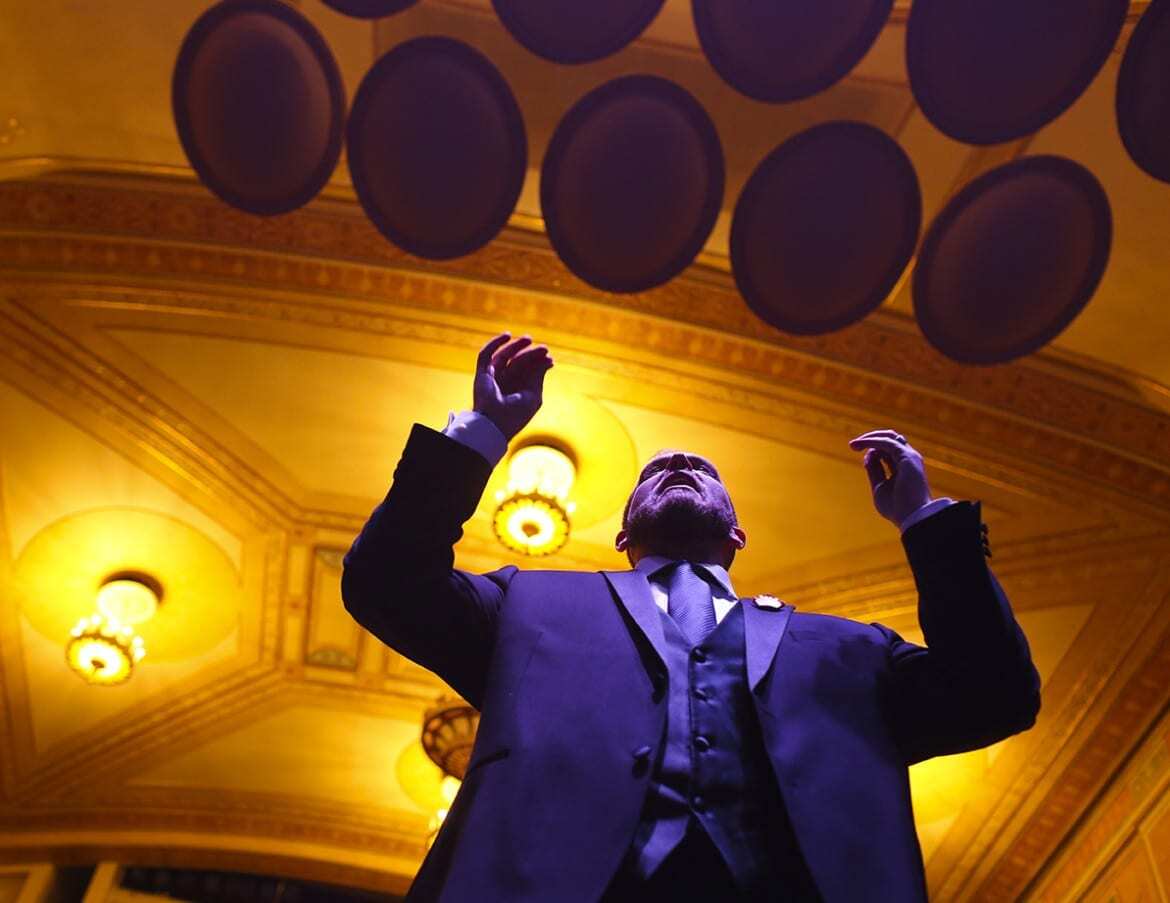Artistic Director, Dustin Cates leads the Heartland Men's Chorus during a rehearsal on Thursday, December 3rd at The Folly Theater for their Holiday Concert. (Photo: Jim Barcus)