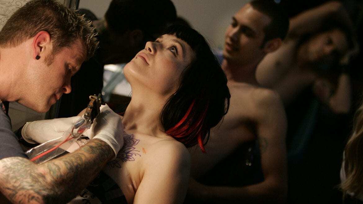 A woman getting a tattoo