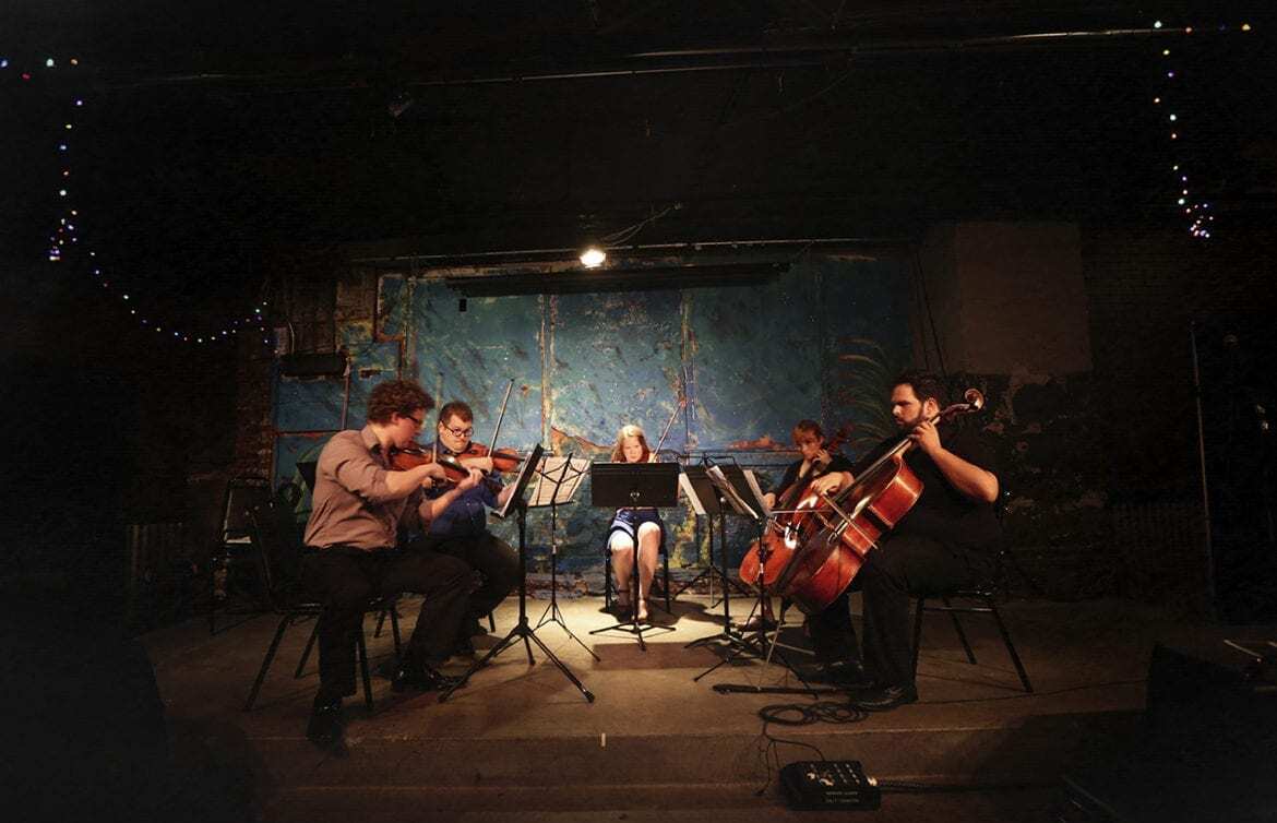 Classical music group performs.