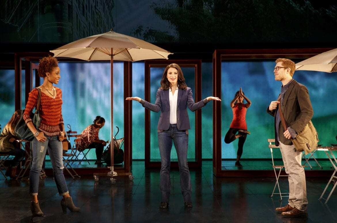 A woman stands on a stage.