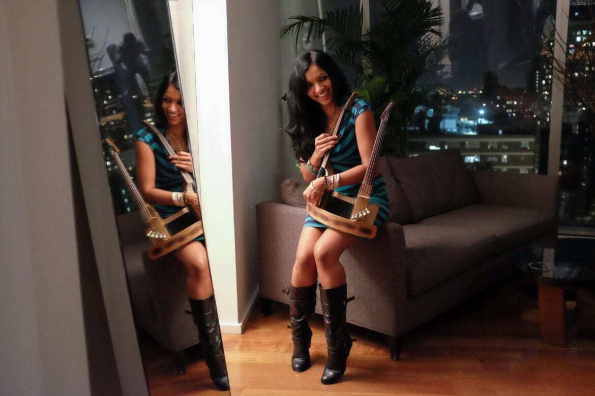 A woman with a 10-string double violin.