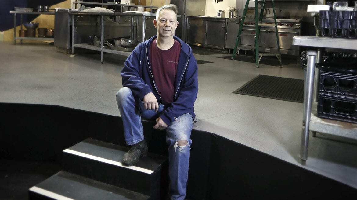 A scenic designer on stage