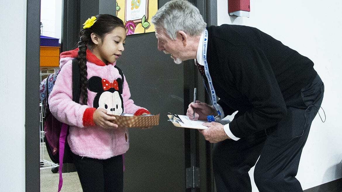 paul preston greeting a student