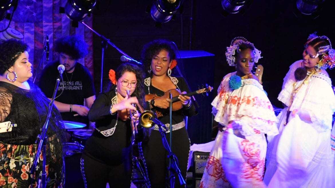 women singing and playing instruments