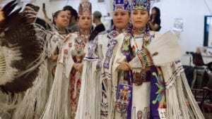 The junior and senior buckskin dancers line up