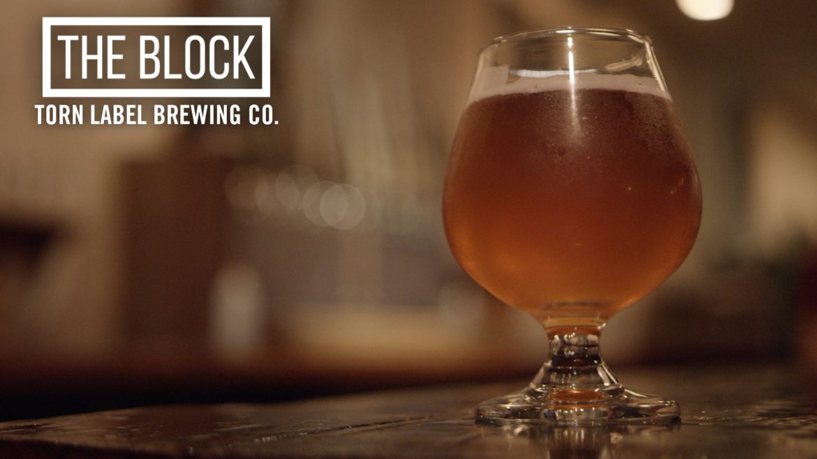 Rafi Chaudry and Travis Moore, co-owners of Torn Label Brewing Co., set aside promising career opportunities in Hollywood and Chicago to brew beer in the Crossroads Arts District.