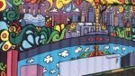 A mural of Kansas City painted on the side of a shipping container.