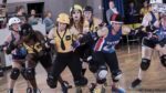 A pack of skater shove their way toward the camera.