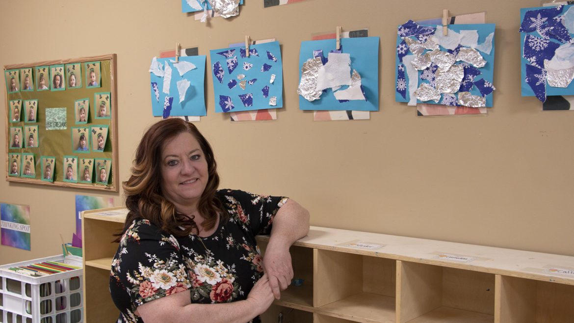 Sheri Lee stands in playroom at her facility