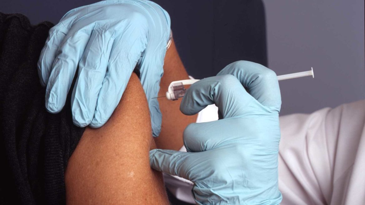 Person receiving an injection.