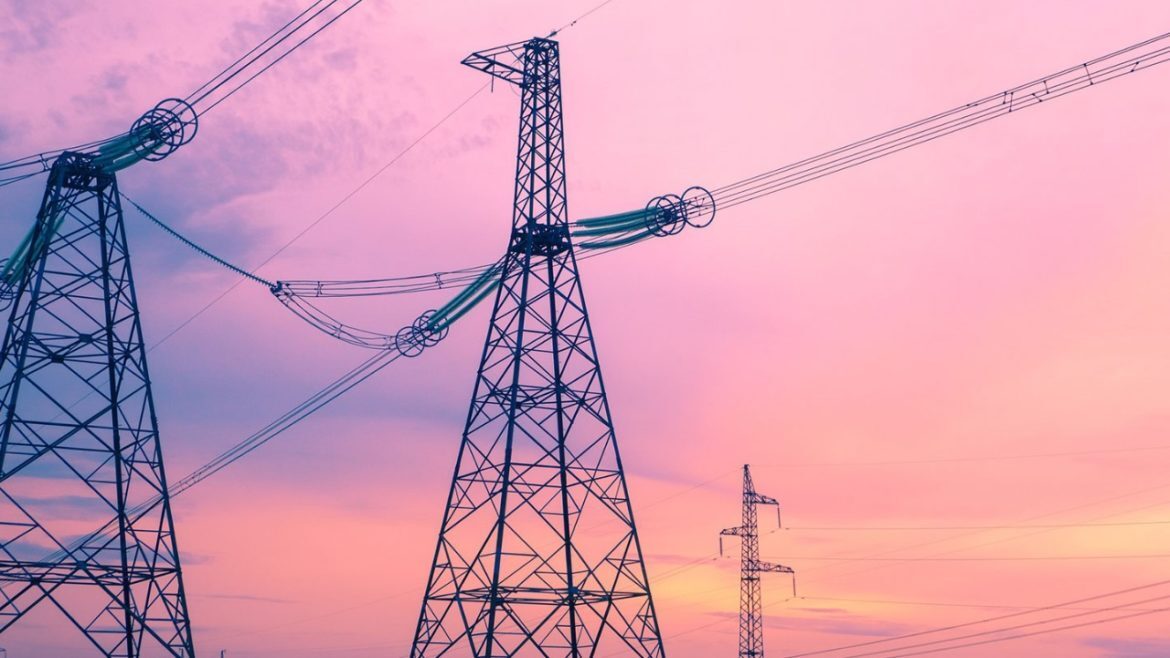 A view of power lines against a pink sunset illustrates a story about how the climate changes affect utility costs and burdens. Flatland reporters Vicky Diaz-Camacho and Catherine Hoffman will report on this issue for the next Flatland Show episode, entitled "The Cost of Utilities in Kansas City."