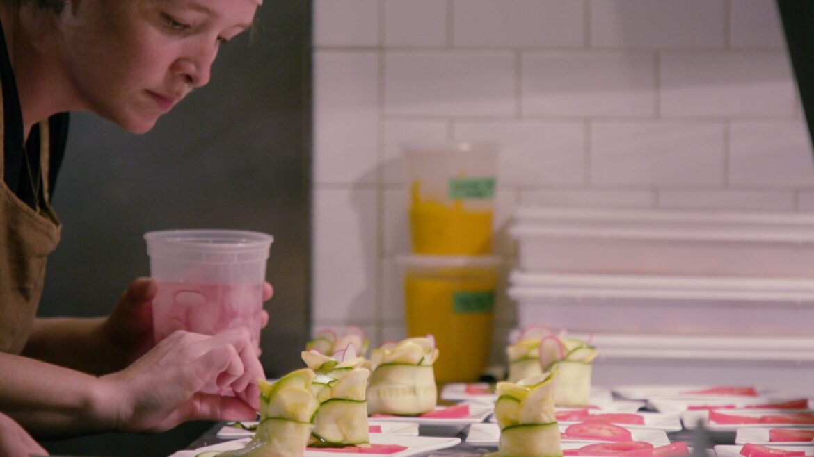 Chef Sara Osborn prepares a meal.