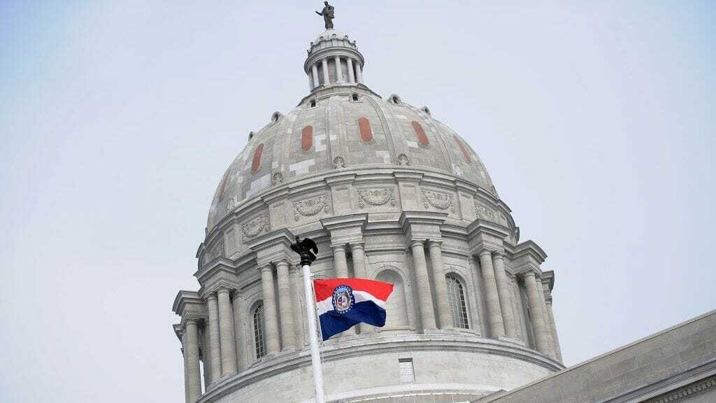 The Missouri state flag is seen flying outside the Missouri State Capitol Building on Jan. 17, 2021, in Jefferson City.