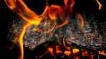 Barbecue engulfed in flames.